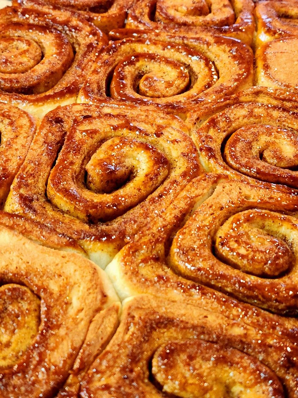 Freshly baked cinnamon rolls with warm glaze