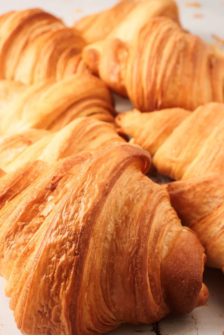 Golden flaky croissant showing layers and texture